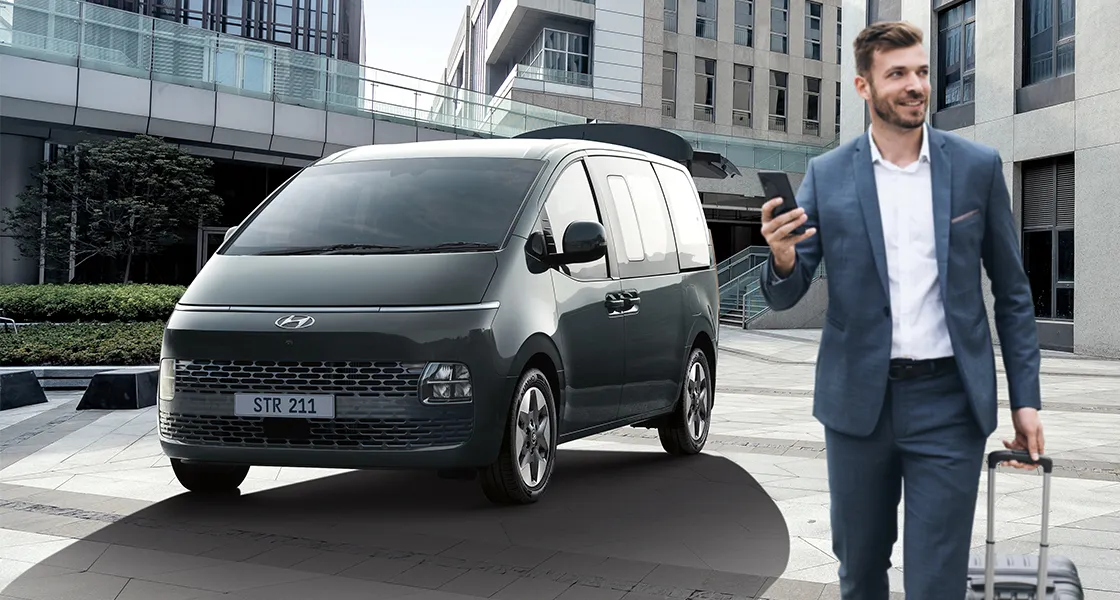 Two Starex in a storage house loading cartens in it