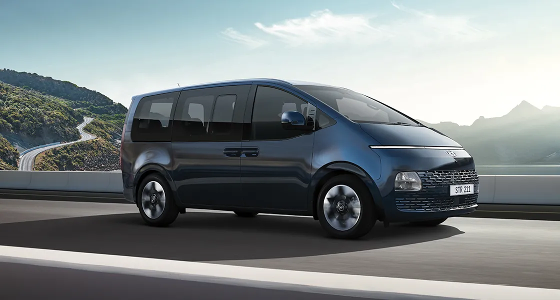 Two Starex in a storage house loading cartens in it